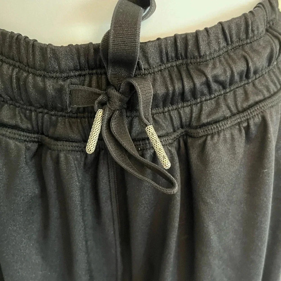 Lululemon black joggers with drawstring elastic waist band, and hemline.  Size 4 - Picture 2 of 13